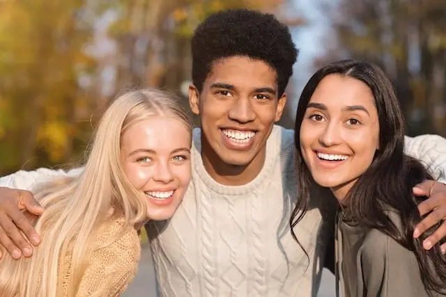 Three friends together outdoors