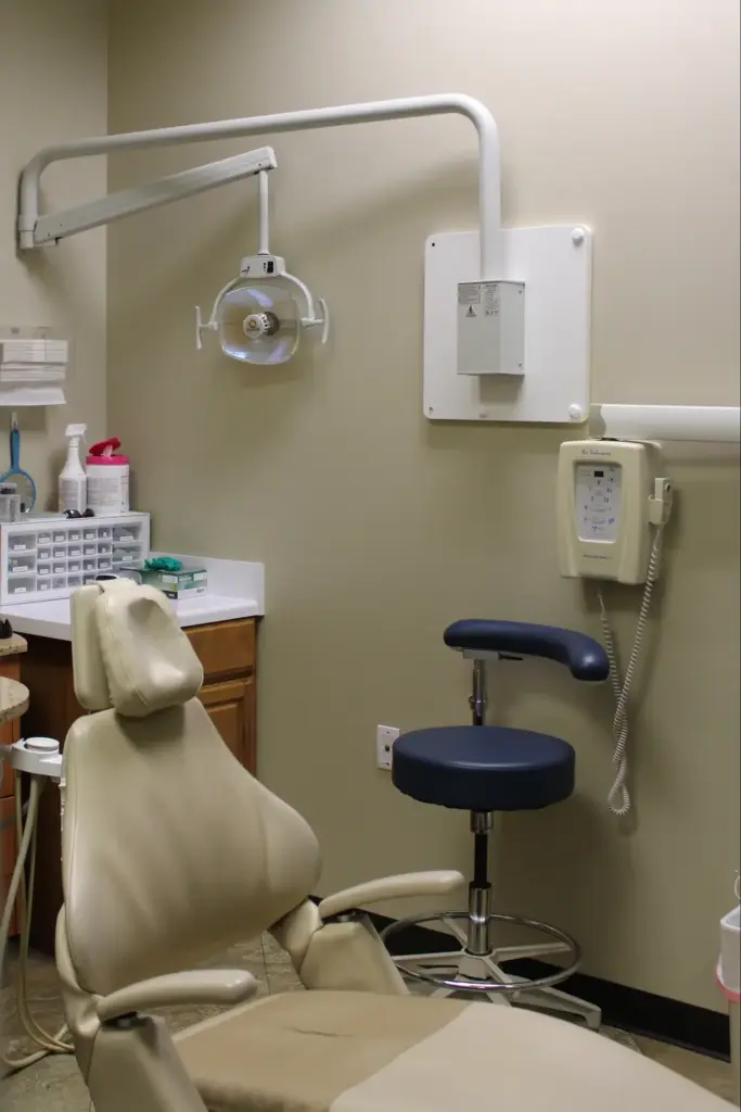 A treatment room at Dentistry For You in Broken Arrow, with a patient chair and overhead light