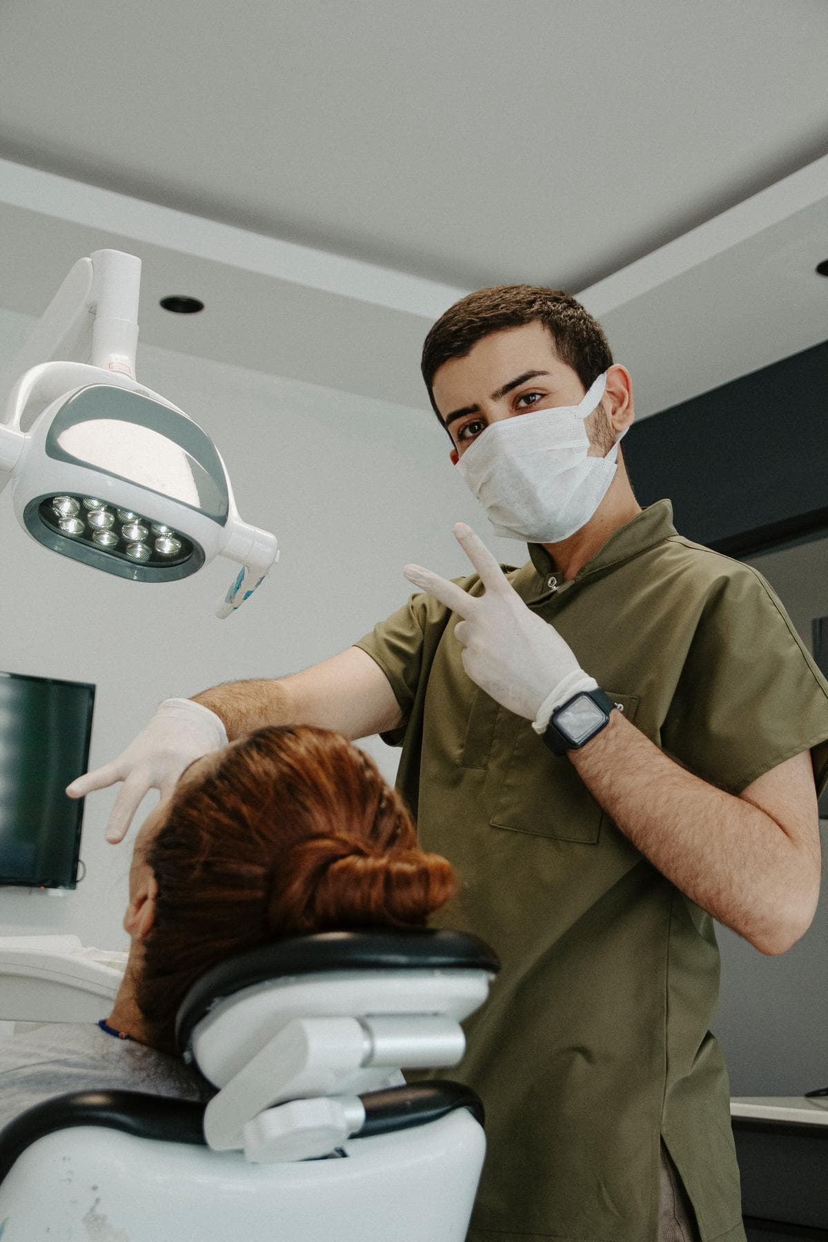 An image depicting a tooth extraction procedure being carried out by a dentist.